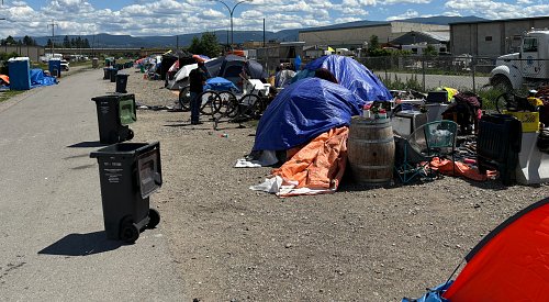 VIDEO: Rules, restrictions and curfews have people choosing the rail trail encampment over shelters